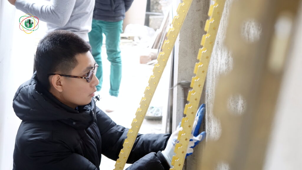 Candidates training in drywall installation at Hop Luc Training Center ahead of the European recruitment test