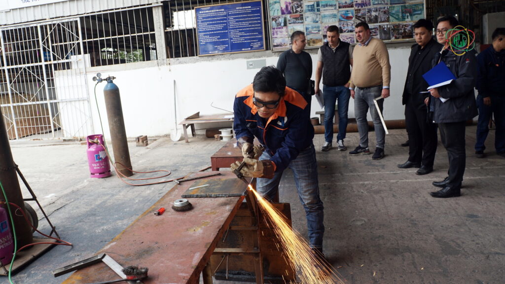 European recruiter evaluating Vietnamese welder during hands-on skill test in Hanoi