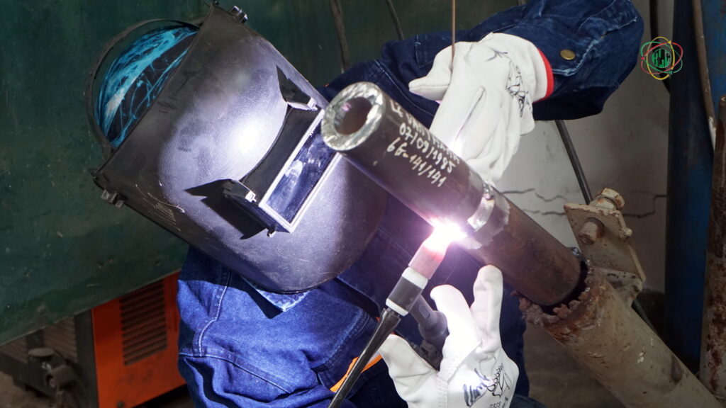 Vietnamese certified welders for Europe performing advanced welding simulation during skill assessment.