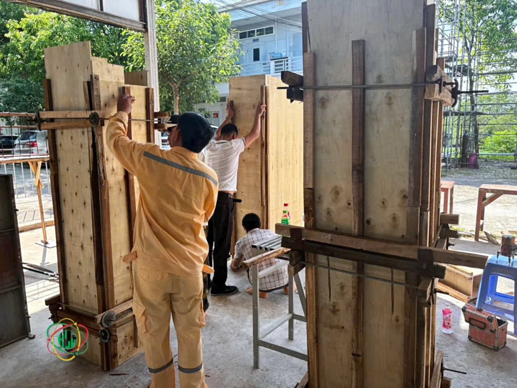Vietnamese technical trainees in a workshop, learning mechanical or electrical skills