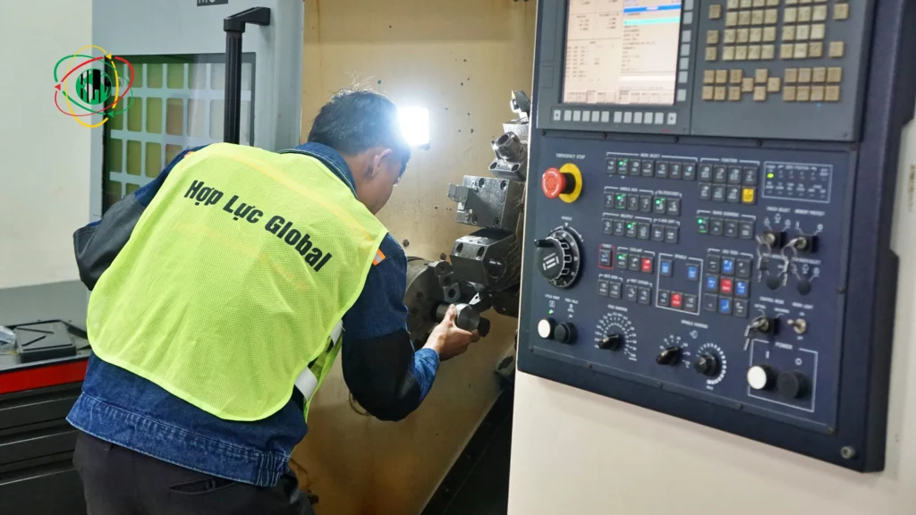 Vietnamese skilled manpower undergoing practical skills assessment for European industrial roles.