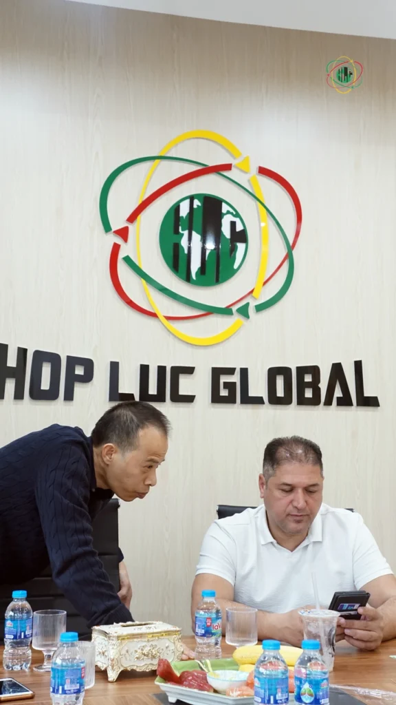 A professional business meeting discussing international recruitment compliance and licensing.