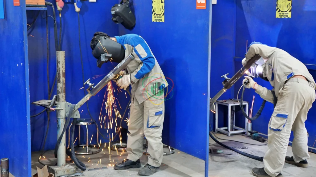 Vietnamese welder undergoing practical skills assessment in dedicated trade testing facility