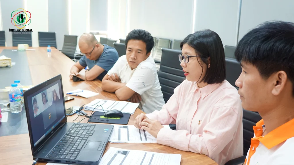 Recruiter reviewing candidate work history documents during a structured interview